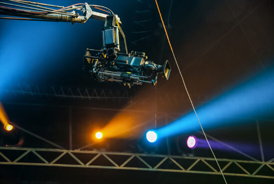 TV camera on crane on concert. TV camera